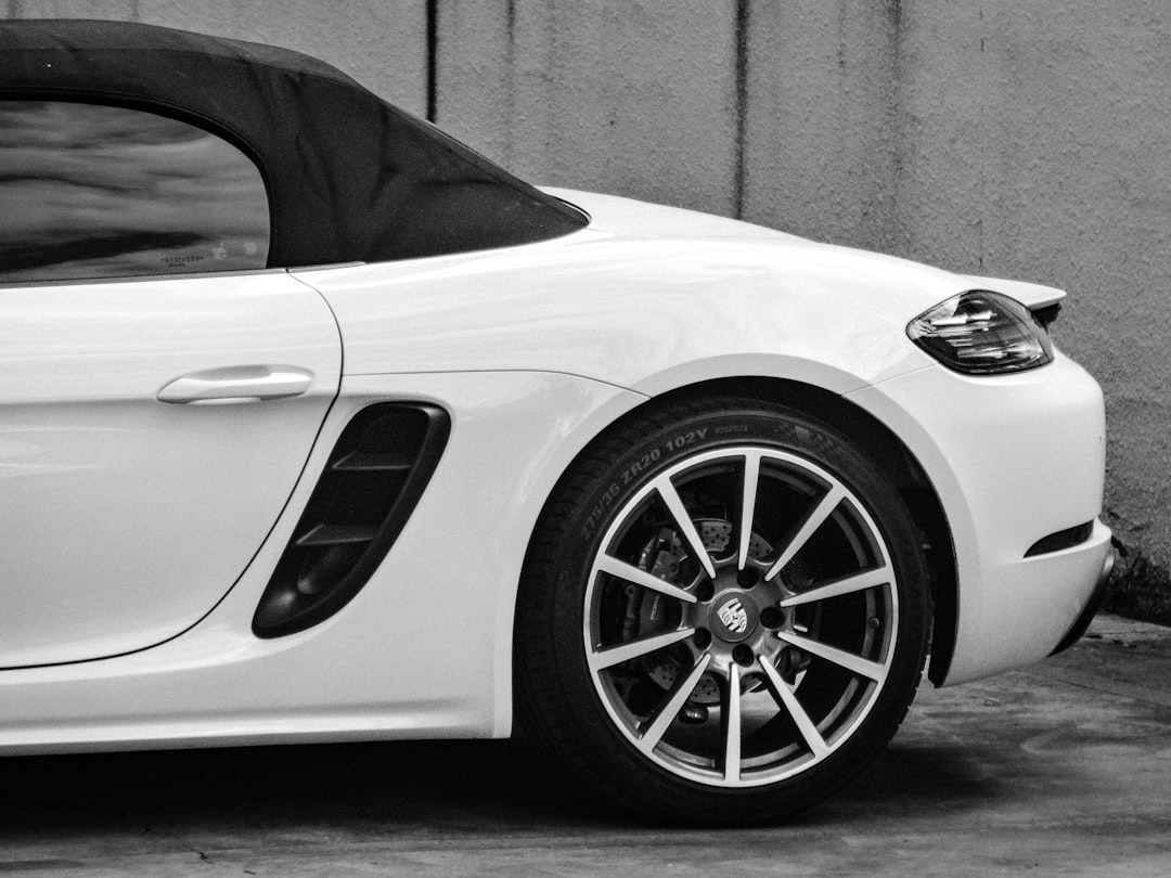 White Porsche convertible in warm daylight
